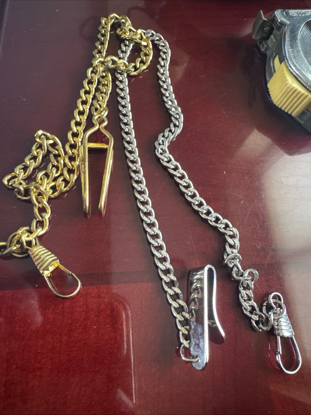 Two pocket watch chains 14”. Silver and gold
